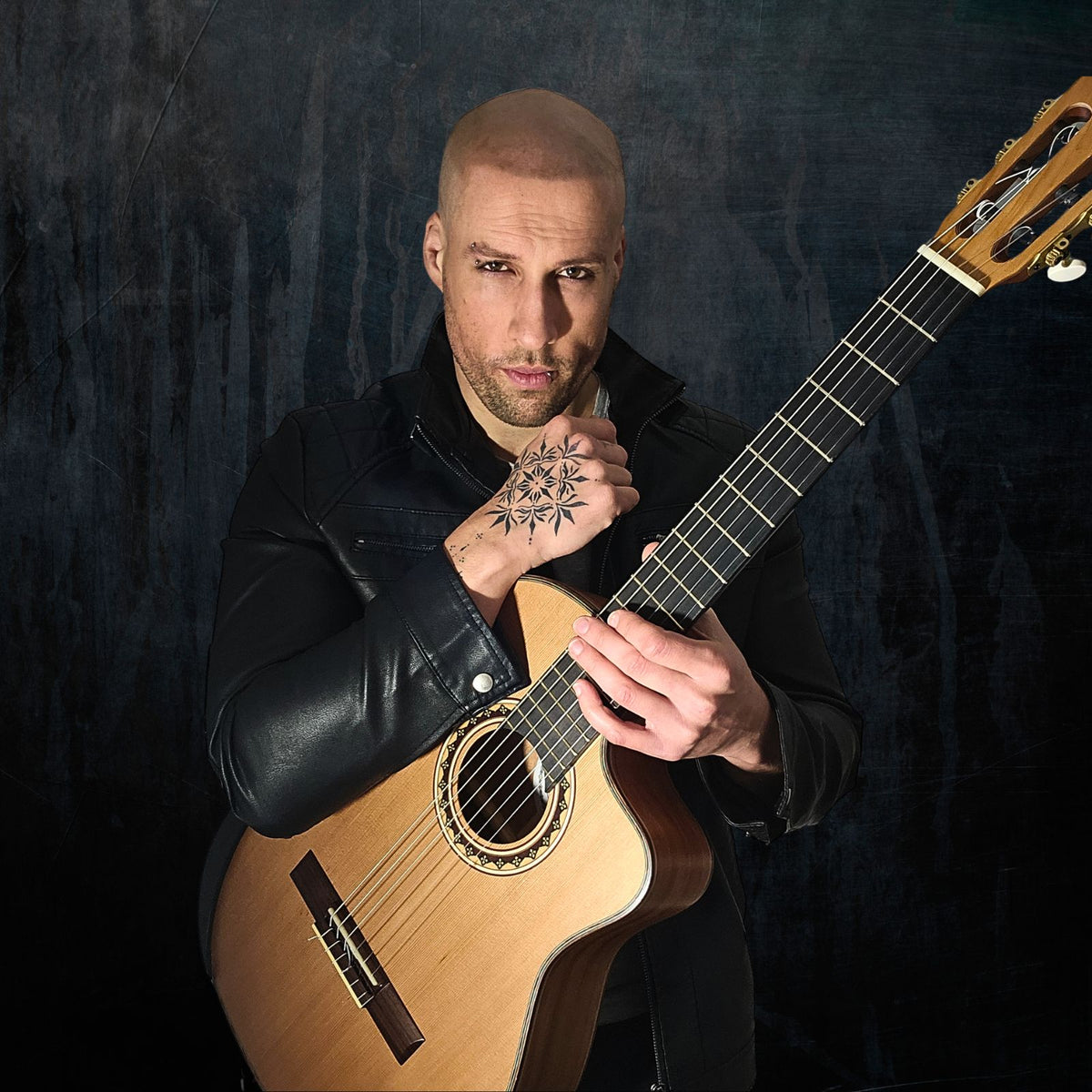 Tatum Marshall playing a Manuel Rodriguez guitar.